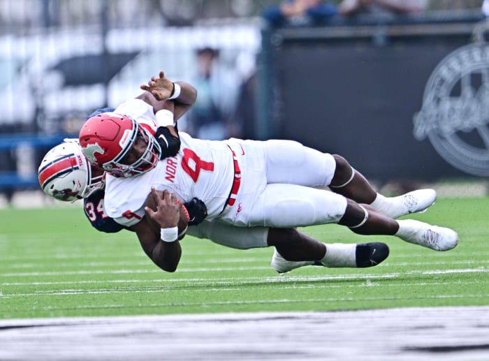 Atascocita junior linebacker Jordan Johnson brings down North Shore QB Kaleb Bailey in the first half of a UIL 6A Division I regional final showdown with nationally ranked North Shore on Saturday.